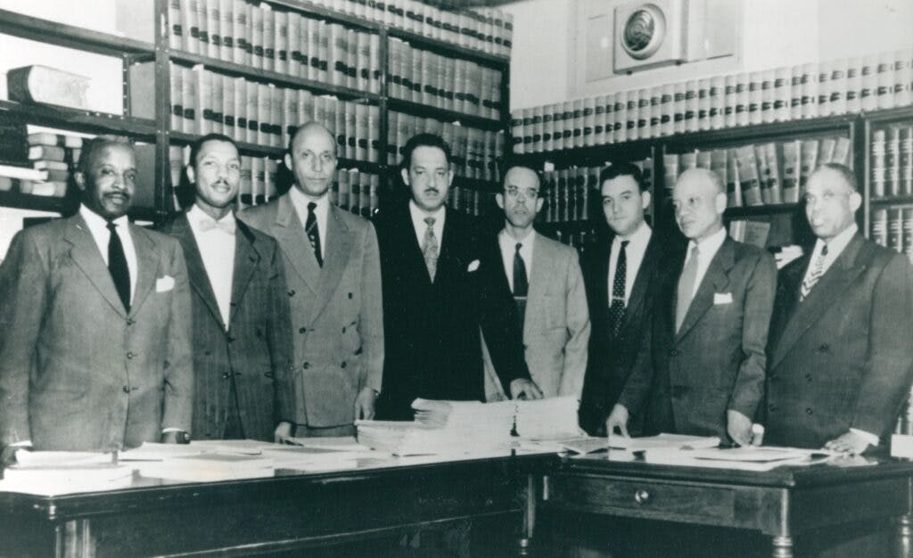 Photo of 6 lawyers in suits that made up the Brown Legal Team