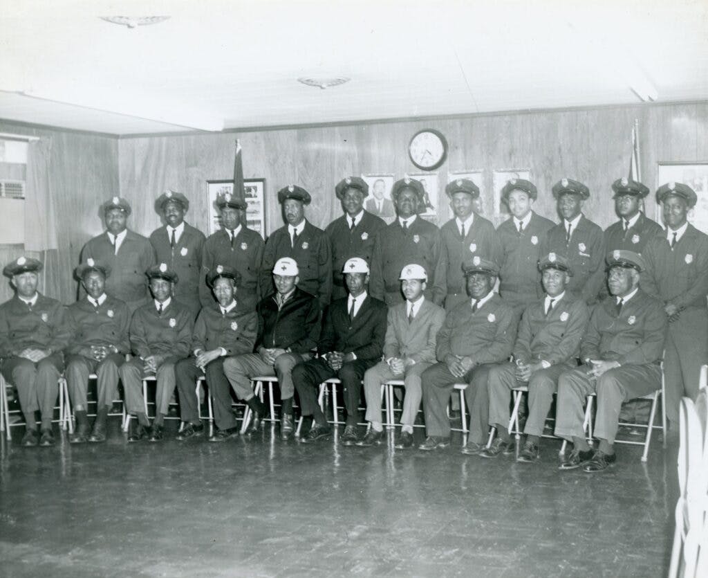 Photo of the uniformed Life Saving Crew, 21 men pictured.