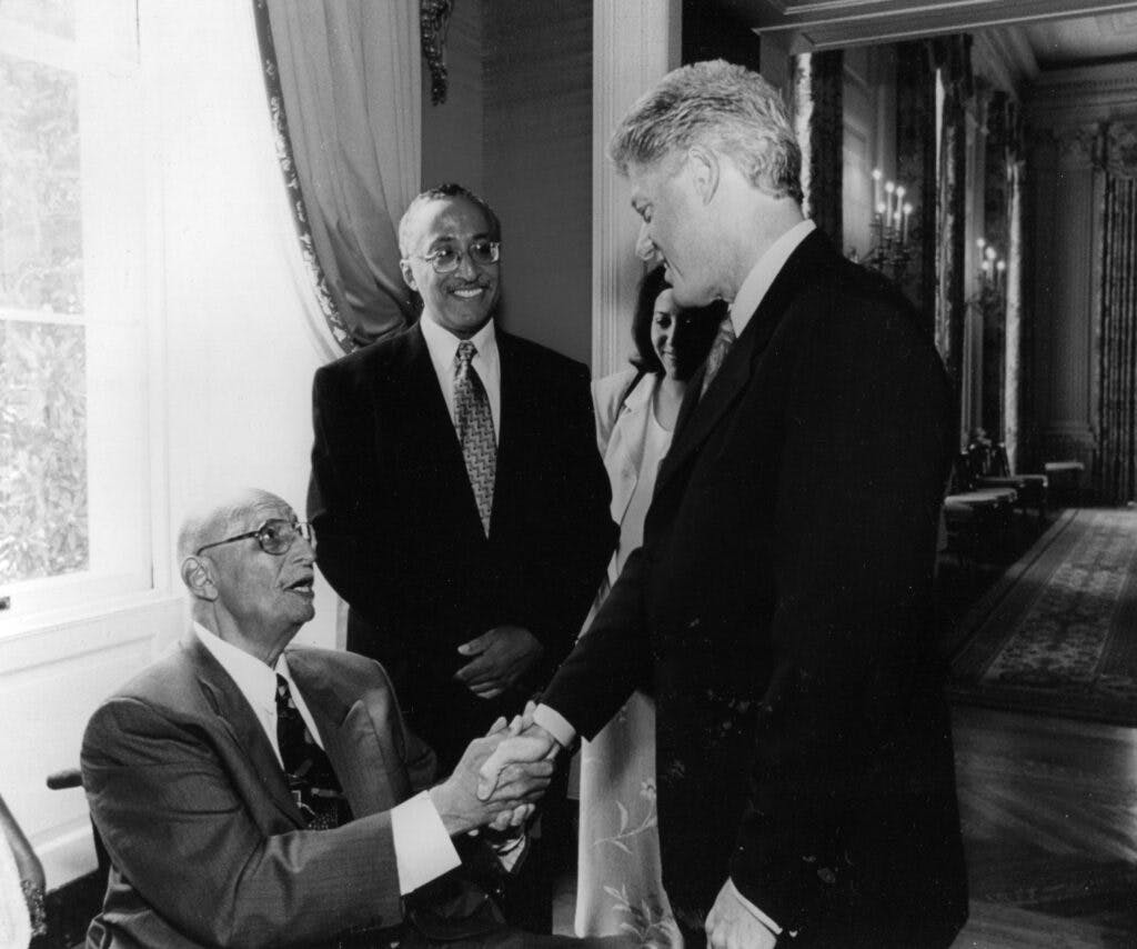 Oliver Hill shaking President Bill Clinton's hand